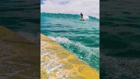 Surfer on a BEAUTIFUL clear wave in Hawai'i
